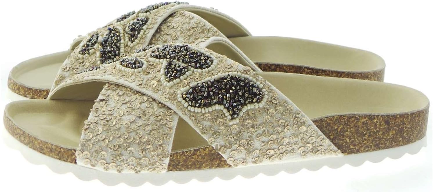 Pavo Monitor Arm installed on a wooden desk showing adjustable positions